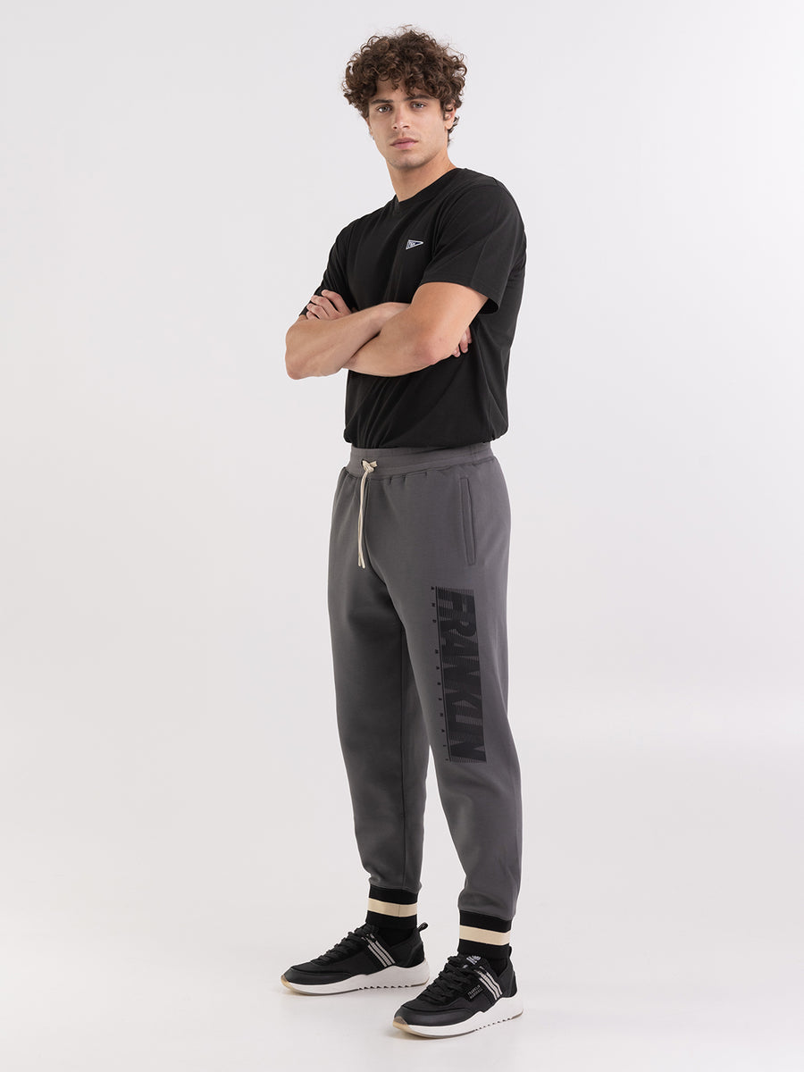 Pantaloni jogger in felpa tech con stampa logo heritage