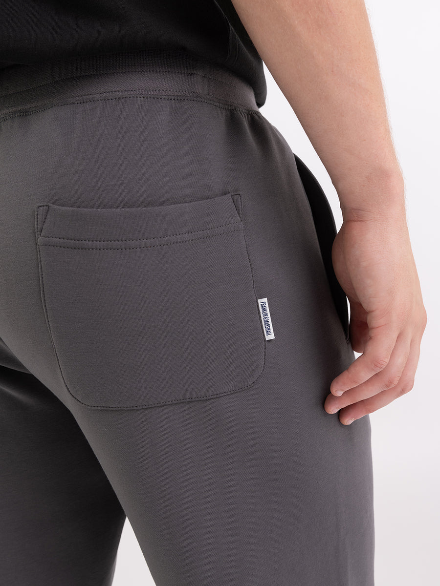 Pantaloni jogger in felpa tech con stampa logo heritage