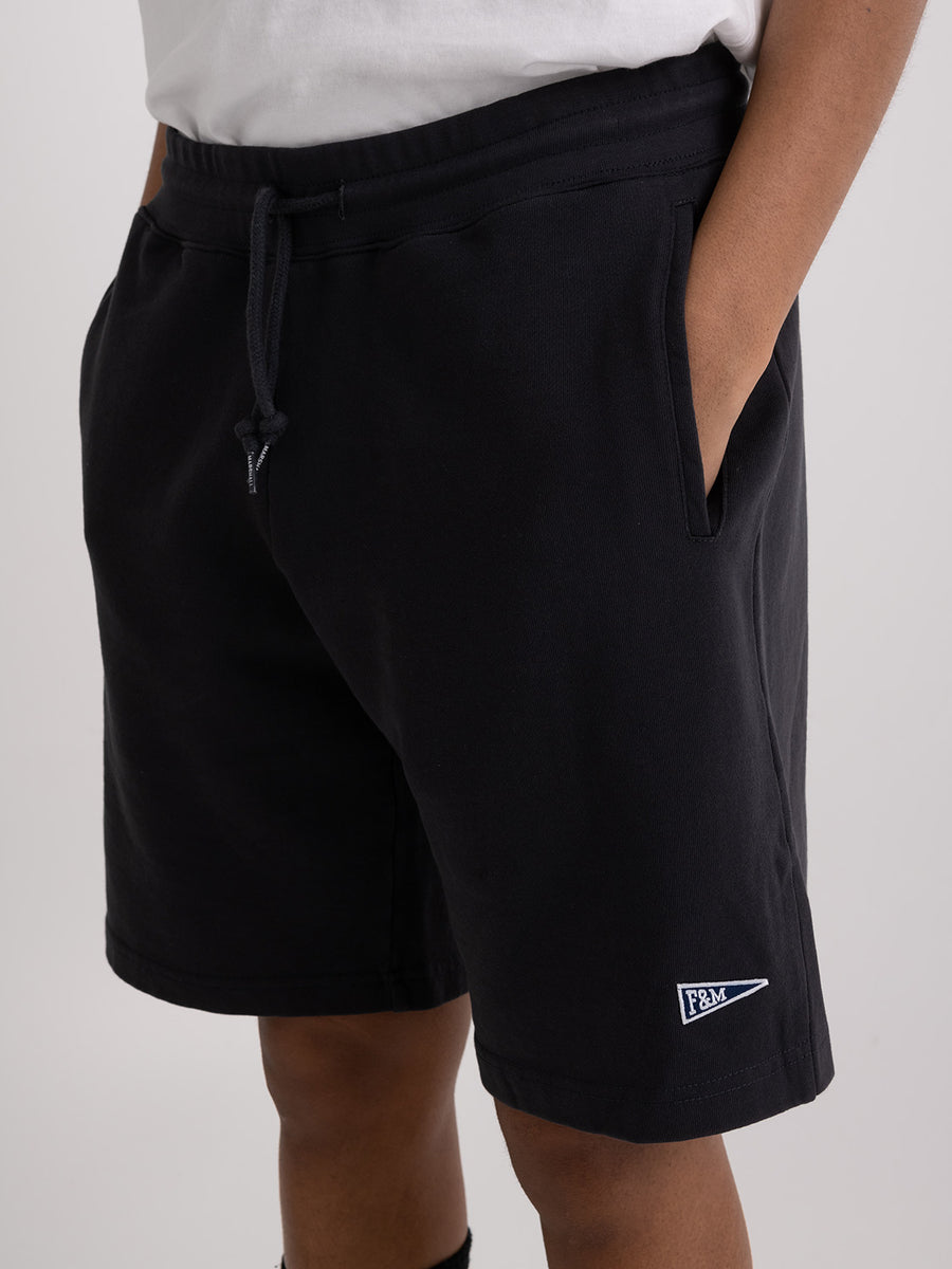 Agender fleece shorts with Pennant patch