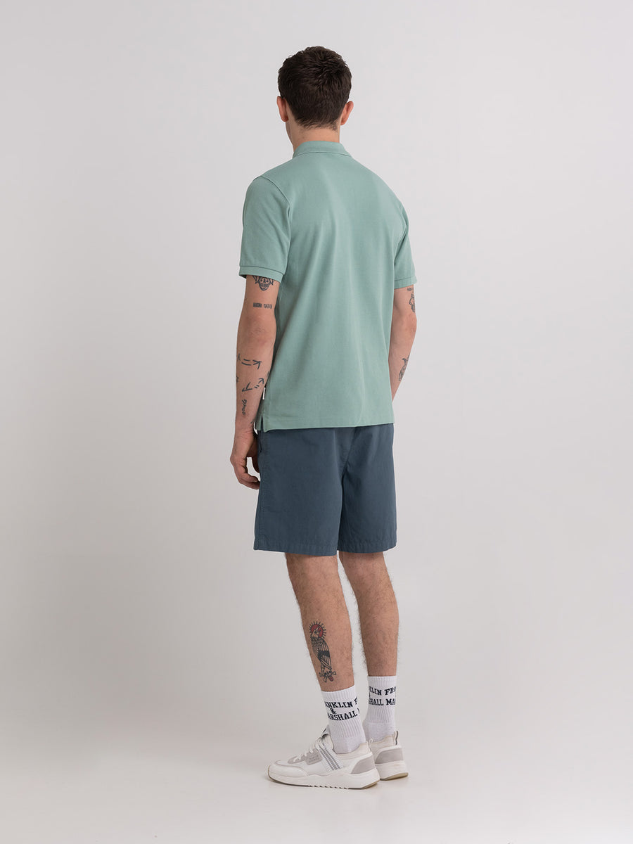 Polo shirt in piqué cotton with arch letter logo embroidery