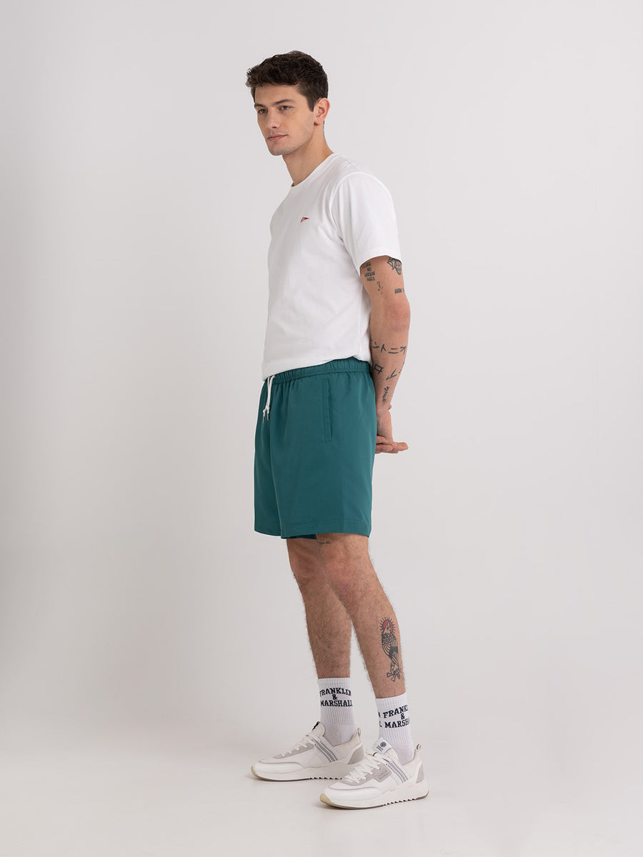 Shaded-off recycled nylon swimming trunks with Crest logo print
