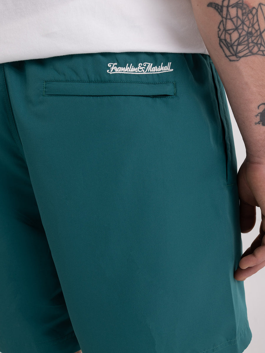 Shaded-off recycled nylon swimming trunks with Crest logo print