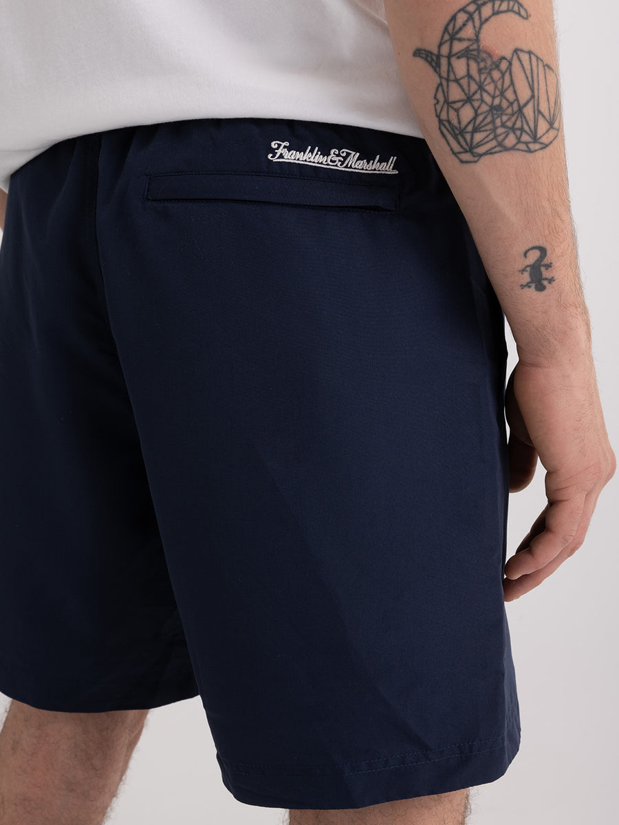 Shaded-off recycled nylon swimming trunks with Crest logo print