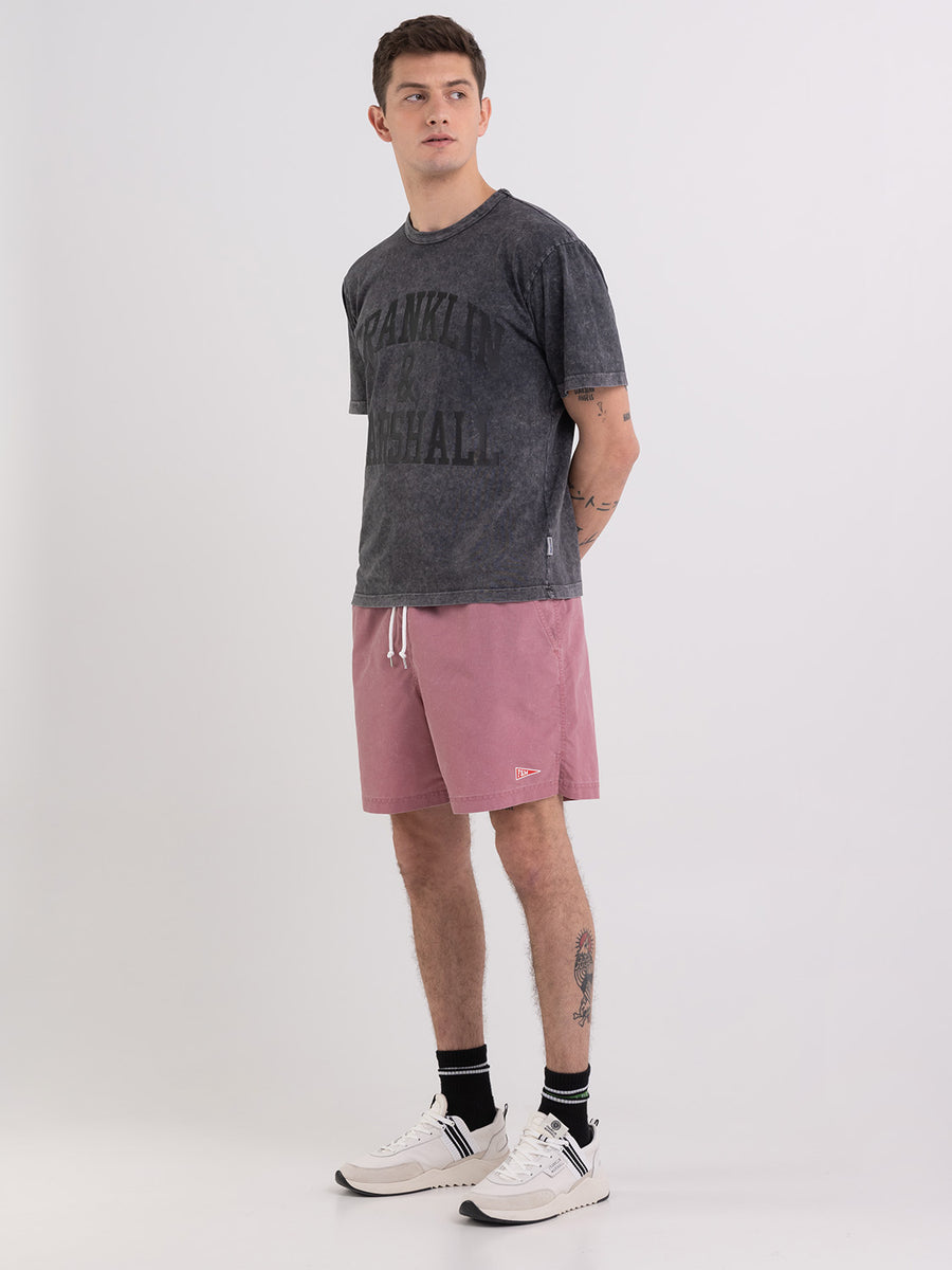 Acid wash garment-dyed t-shirt with arch letter logo print