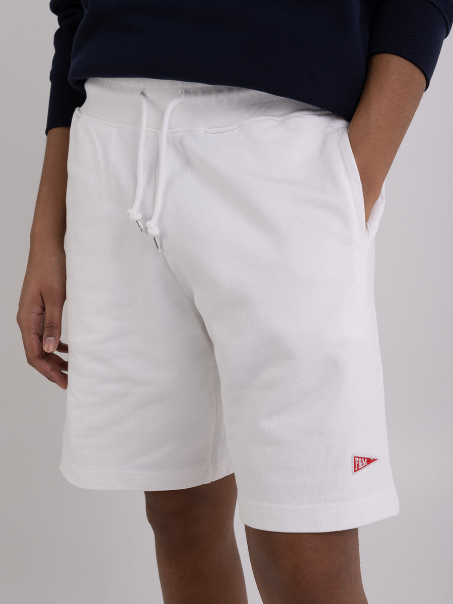 Agender fleece shorts with Pennant patch