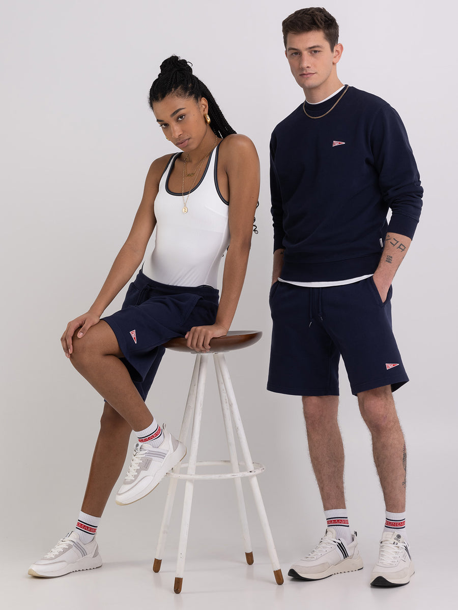 Agender fleece shorts with Pennant patch