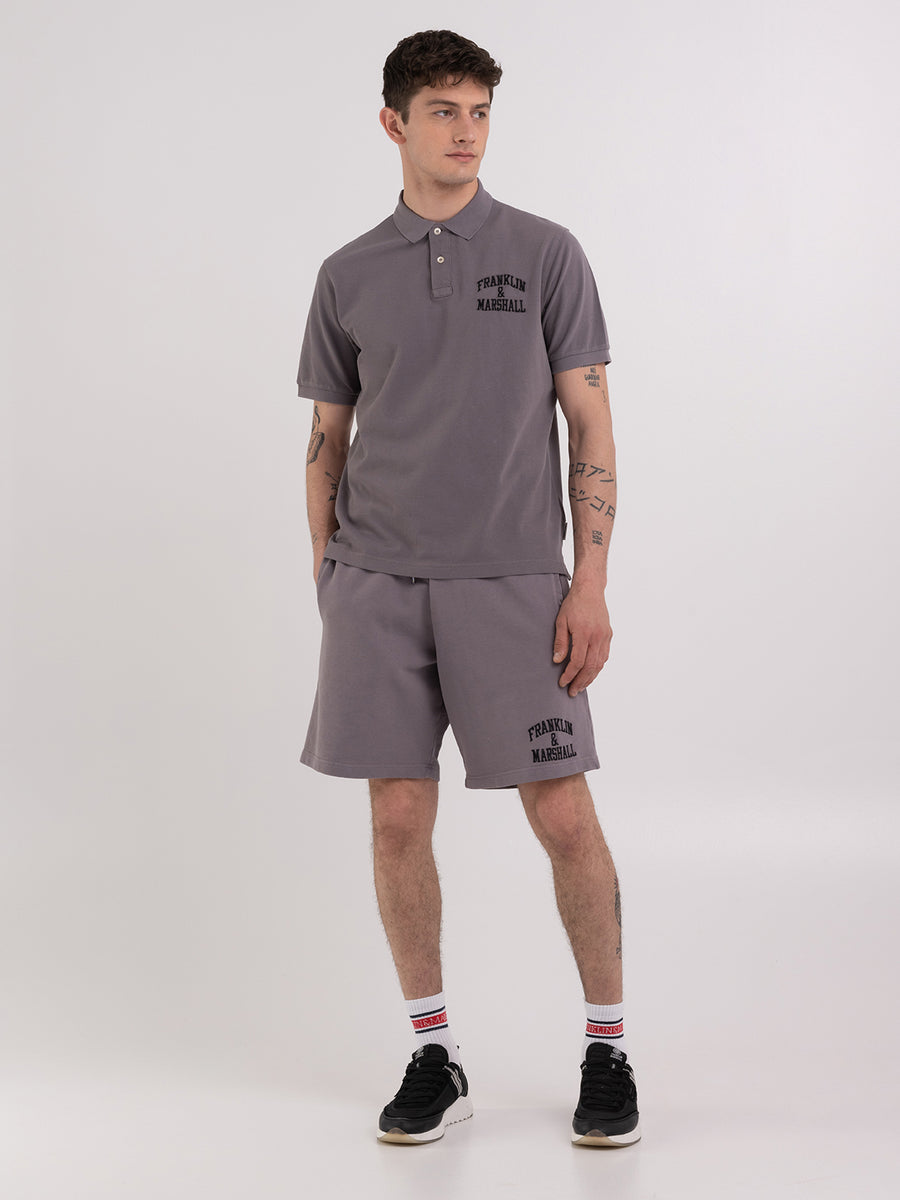 Polo shirt in piqué cotton with arch letter logo embroidery