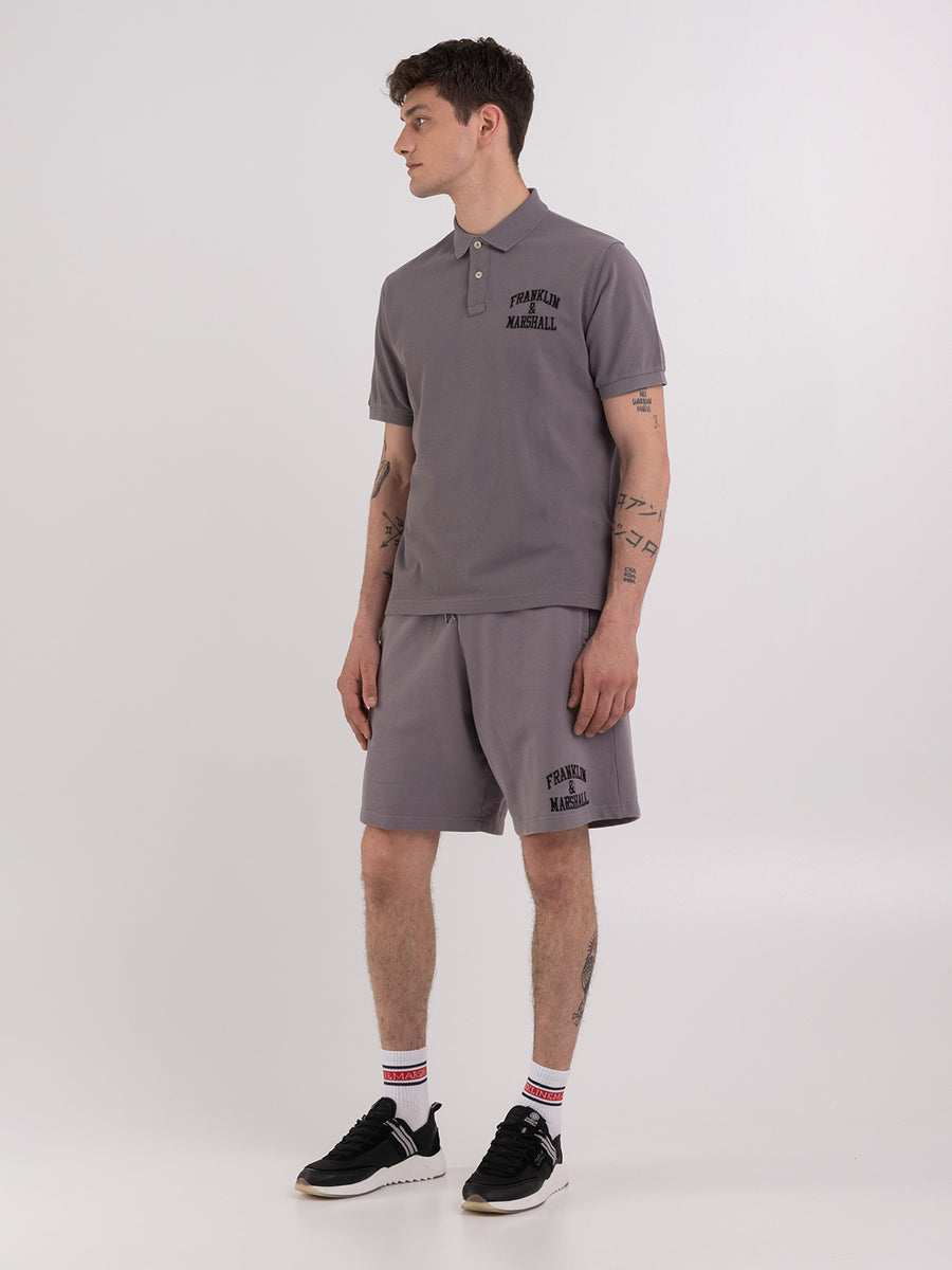 Polo shirt in piqué cotton with arch letter logo embroidery