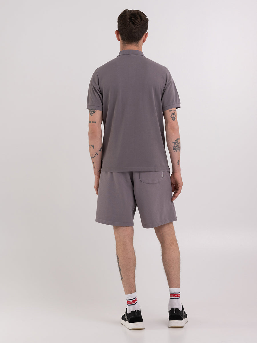 Polo shirt in piqué cotton with arch letter logo embroidery