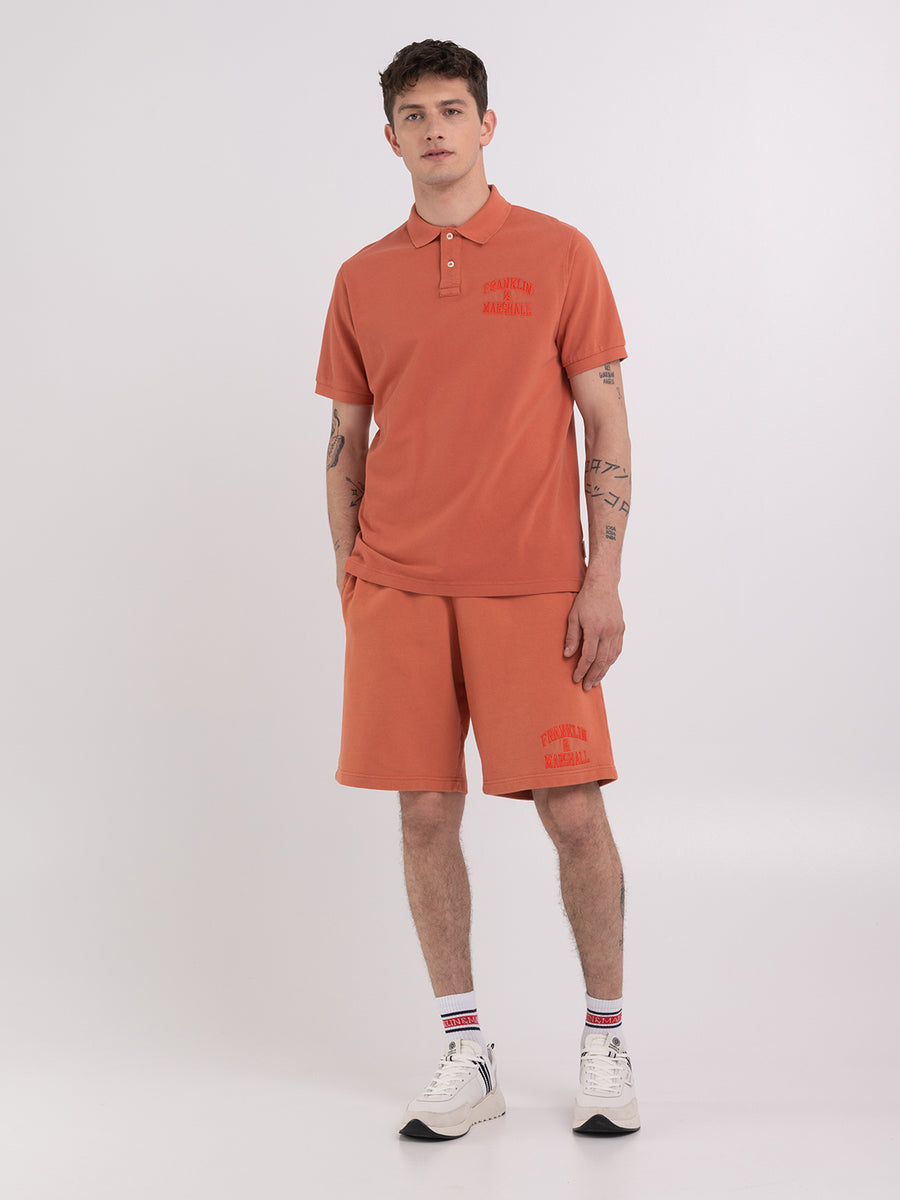 Polo shirt in piqué cotton with arch letter logo embroidery