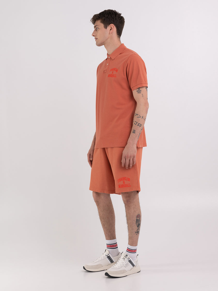 Polo shirt in piqué cotton with arch letter logo embroidery